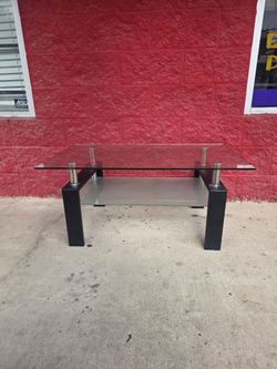 Compact and contemporary coffee table, very heavy duty and the glass is on permanently,  $100