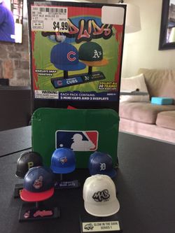 Collectible MLB mini caps with stands.