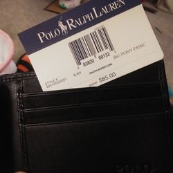 Ralph Lauren wallet, in New Condition! Never Used , Lost The Box, So Its Just The Wallet. Thanks!