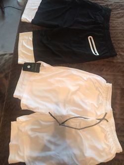 Athletic shorts with phone storage in tights part! Brand new bought but too small says XL but fits as Large. Paid $50 for both will sell for $25 for