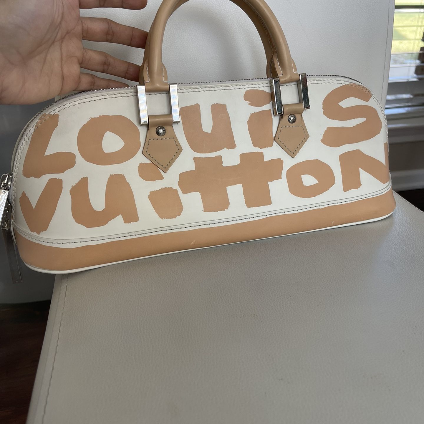 Authentic LOUIS VUITTON BA0061 Monogram Graffiti Alma Horizontal Hand Bag  for Sale in Arlington, TX - OfferUp