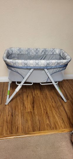 Practically New Portable Folding Rocking Bassinet ( Used Once). Price Firm!!