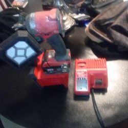 Milwaukee Impact Beam Light And Milwaukee Charger For 20 Volt And For 12 Volt Charger