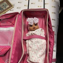 Baby Doll Carrier Suitcase Has Pockets Wheels And Handle Goes Up And Down 