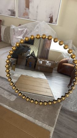 Gold round mirror