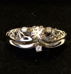 Woman’s 14 karat gold diamond wedding set