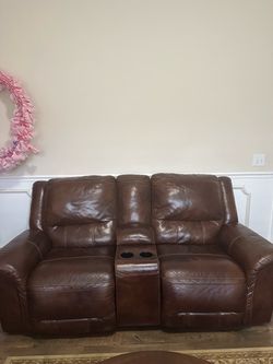 Brown dark leather sofa
