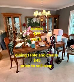Curios and dining table with chairs