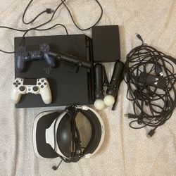 PS4 Pro with VR and the controllers and two blue and white controllers