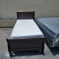 Brown Cherry Twin Size Solid Wood Sleigh Bed Frame With Brand New Twins Size Plush Mattress And Box Spring In Plastic 