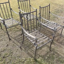 Four Iron Chairs Without Cushions