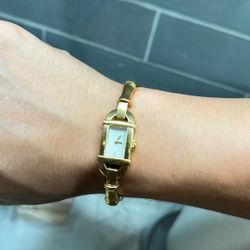 women’s vintage gucci gold timepiece 