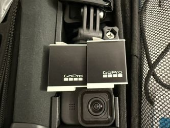 GoPro HERO11 Black Bundle – 2 Batteries, Large Mount Kit, Float Grip, 2 Cases – Excellent Condition