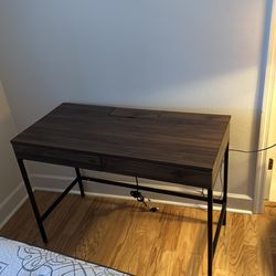 Desk with built in power strip
