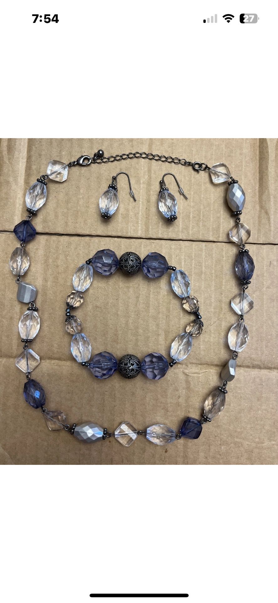 Faux crystal beaded necklace, earrings, and bracelet set.