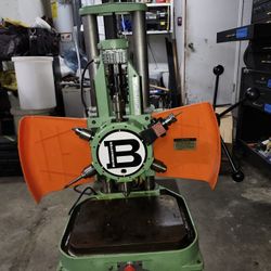 Burgmaster 1-D  Six spindle power indexing Drill Press