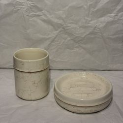 ceramic bathroom accessory set with a marble-effect glaze.