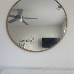 Round gold mirror