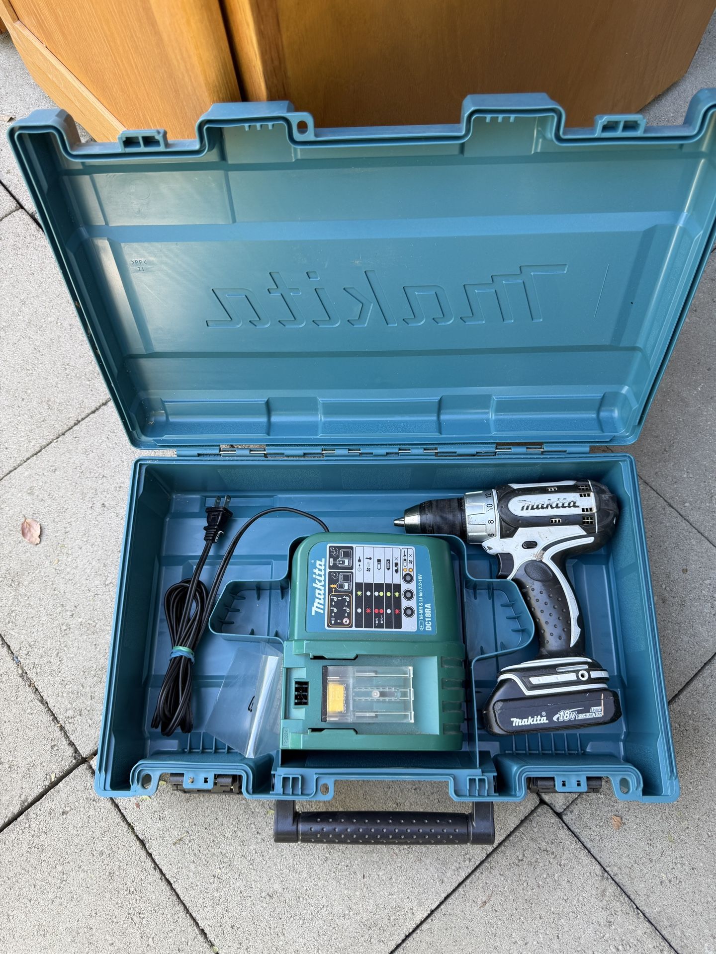Makita drill, charger, and makita case.