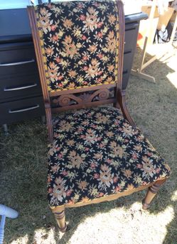 Antique chair with front wheels