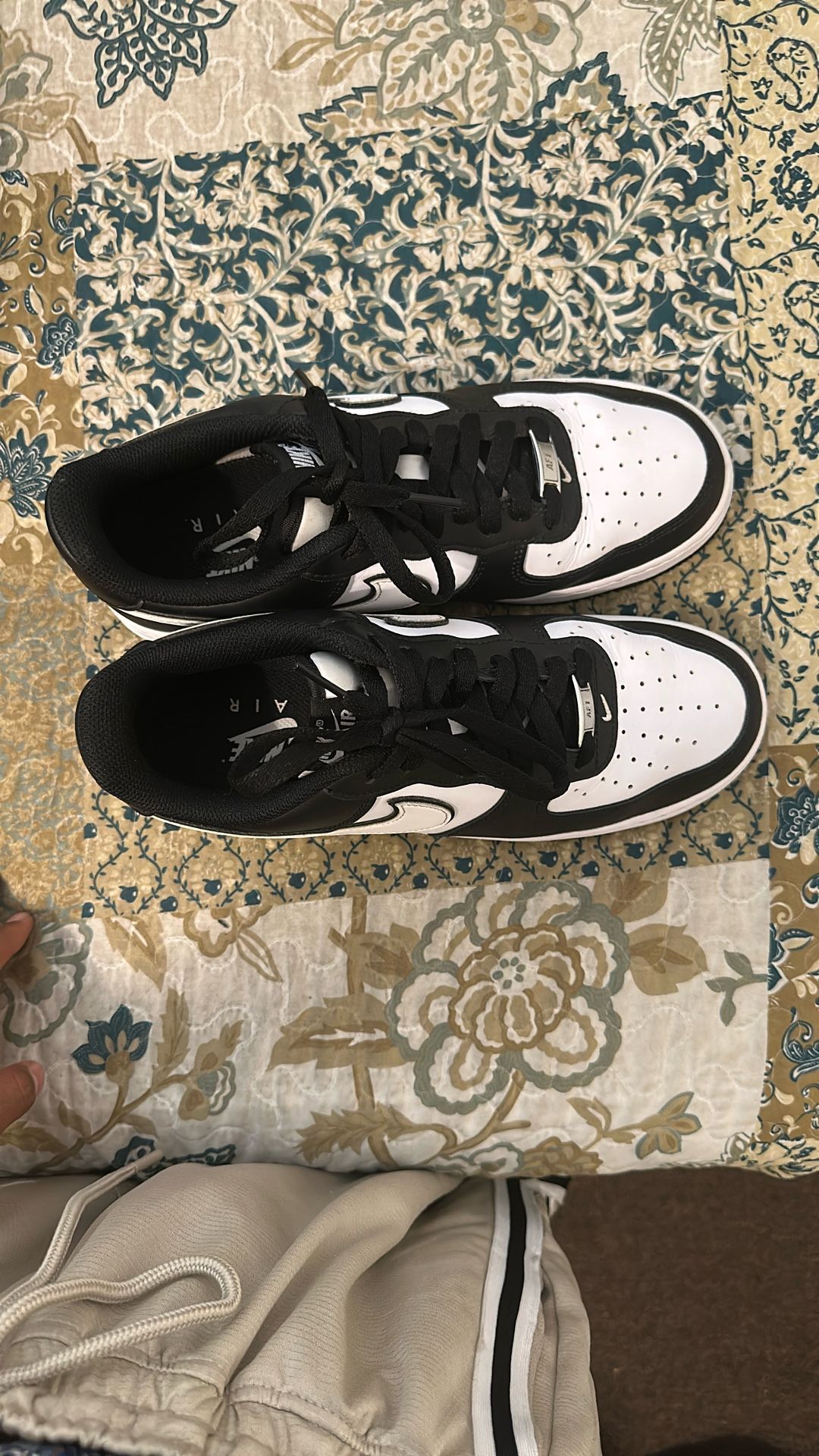 Black/white Air Force 1s + White/grey Nike Windbreaker