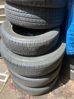 Car tires a couple of them have the rims on it I don’t know how much these go for throw me a price