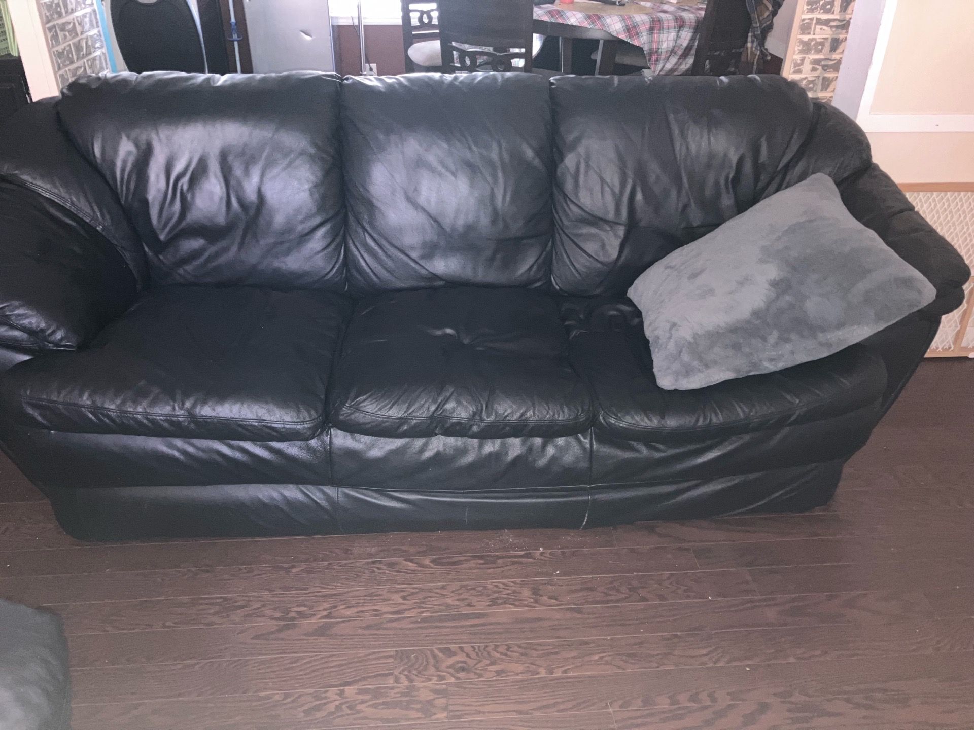Black leather couch and love seat