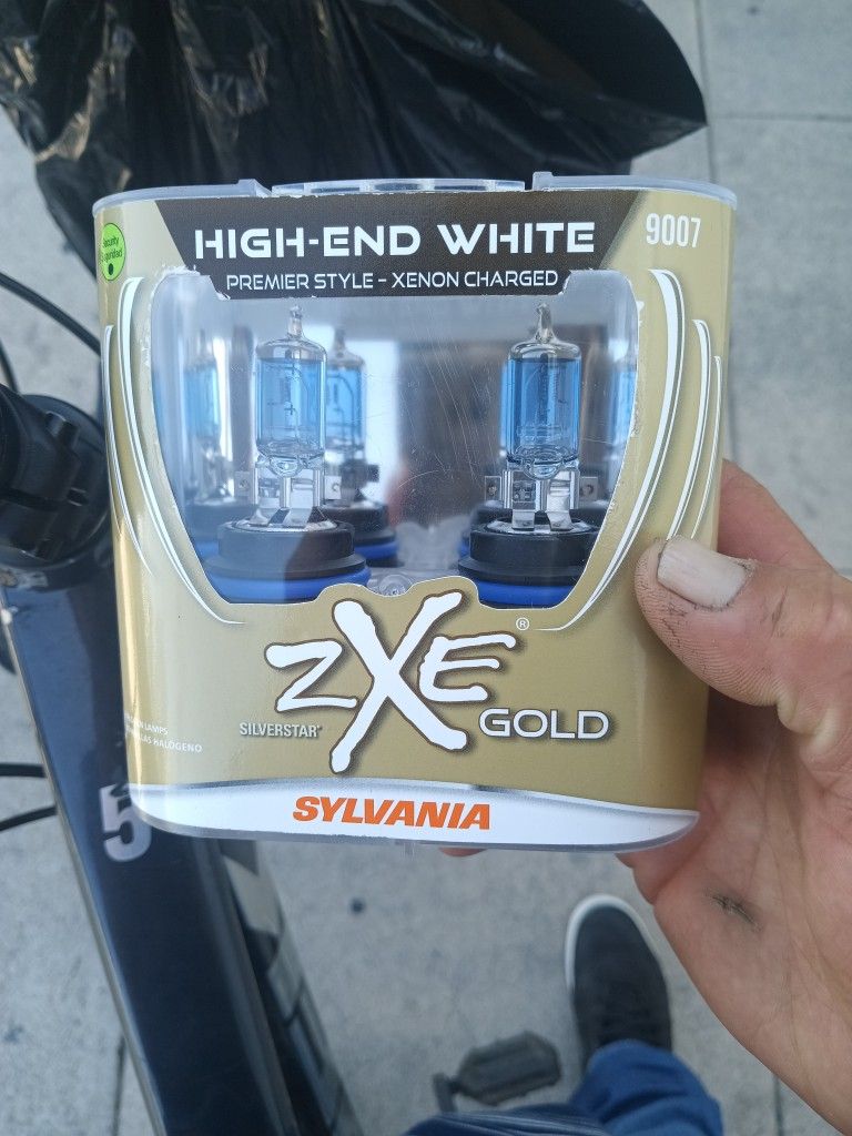 Sylvania ZXE GOLD 9007 Headlight Bulbs. BrNd New