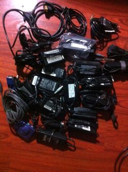 A lot of laptop adapter and ac power cable , computer wire management and more