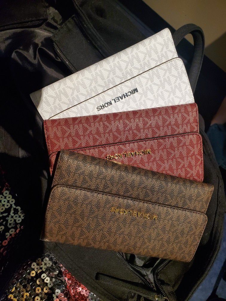 Michael kors and Kate spade wallets for ladies