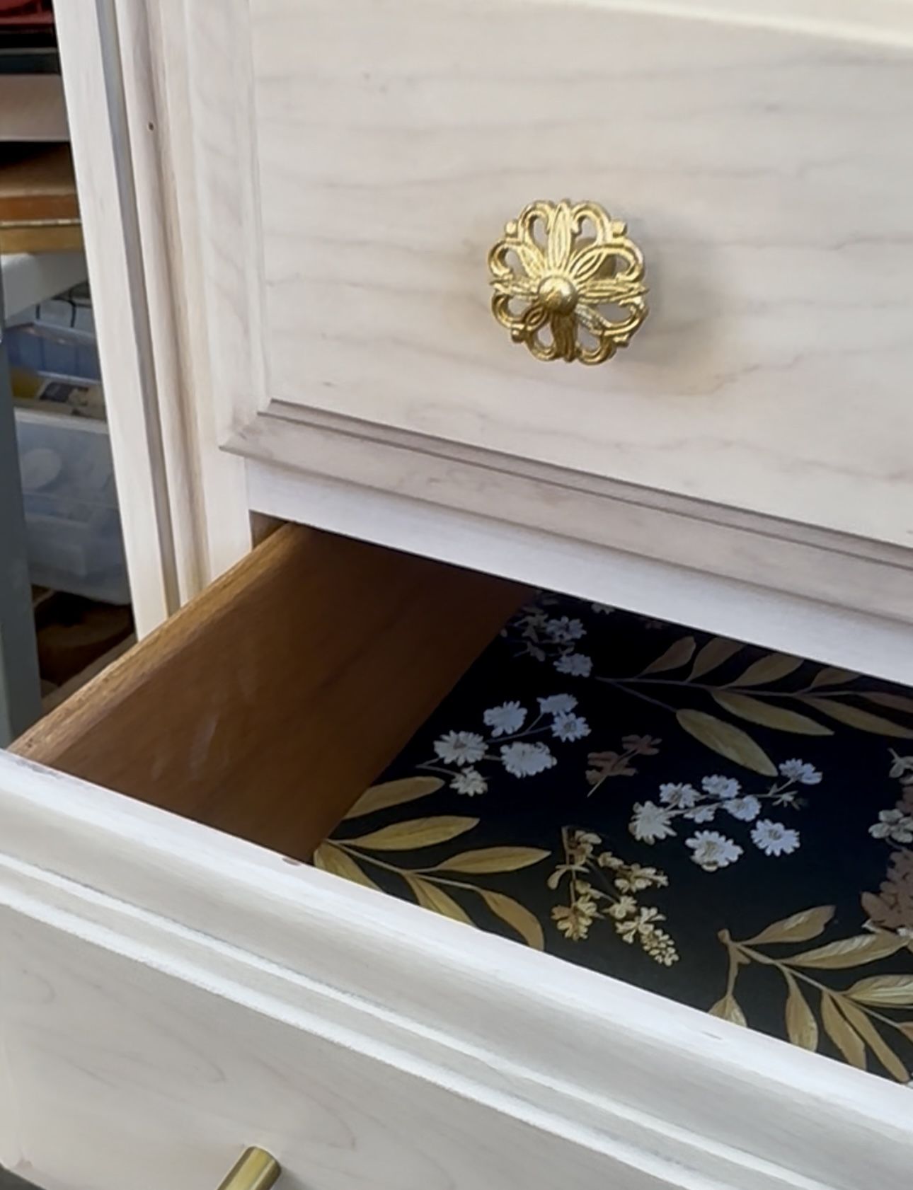 Floral lined wood tallboy dresser. 5 drawers