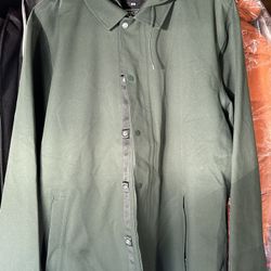 Vans rain jacket    New   (X-L).  Green