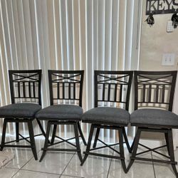 4 Wrought-Iron Swivel Bar Stools