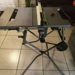 Ryobi 10-inch saw with folding stand — like new condition.