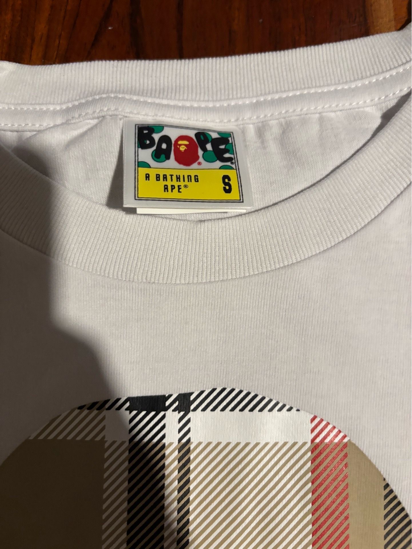 small white bape tee burberry