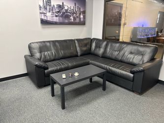 Black Leather Sectional Sofa + coffee table and picture