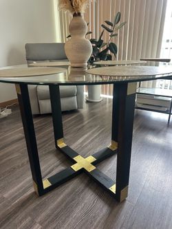Round Glass Dining Table with Black Wood and Brass Base