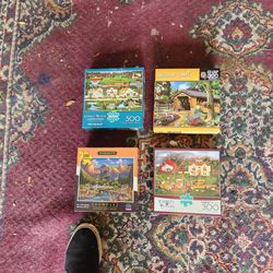4 nice complete jigsaw puzzles....300 - 500 pieces