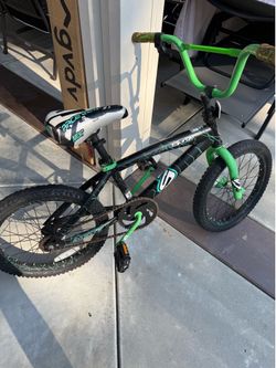 Cool green kids trick bike heavily used