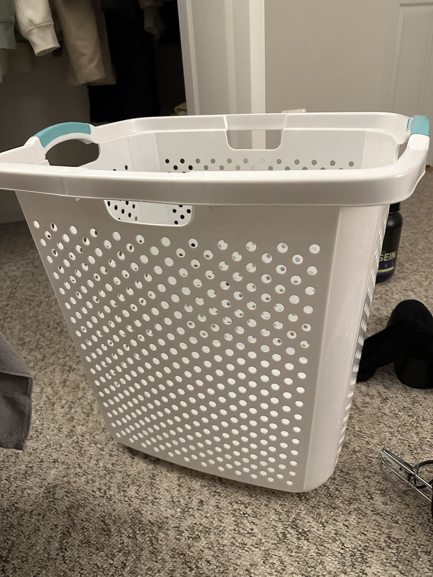 White plastic laundry basket