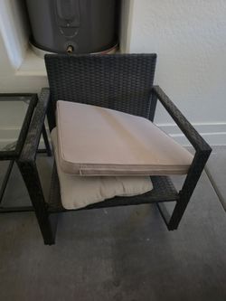 Brown Wicker Chair And Glass Side Table