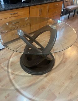 Wood dining table with glass top
