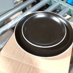 The set contains four dinner plates and four salad plates. Each dinner plate measures 10.5 inches in diameter, and each salad plate measures 8.5 inche