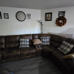 Sectional leather couch with cup holder and 3 part recliner