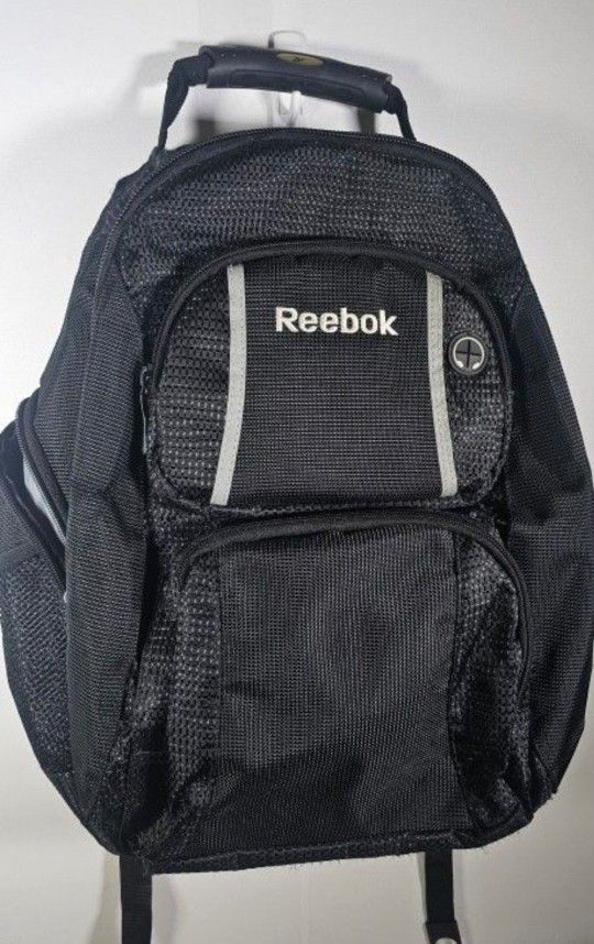 REEBOK BackPack / Bookbag - Black/Gray.  It has multiple pockets and section -laptop compartment