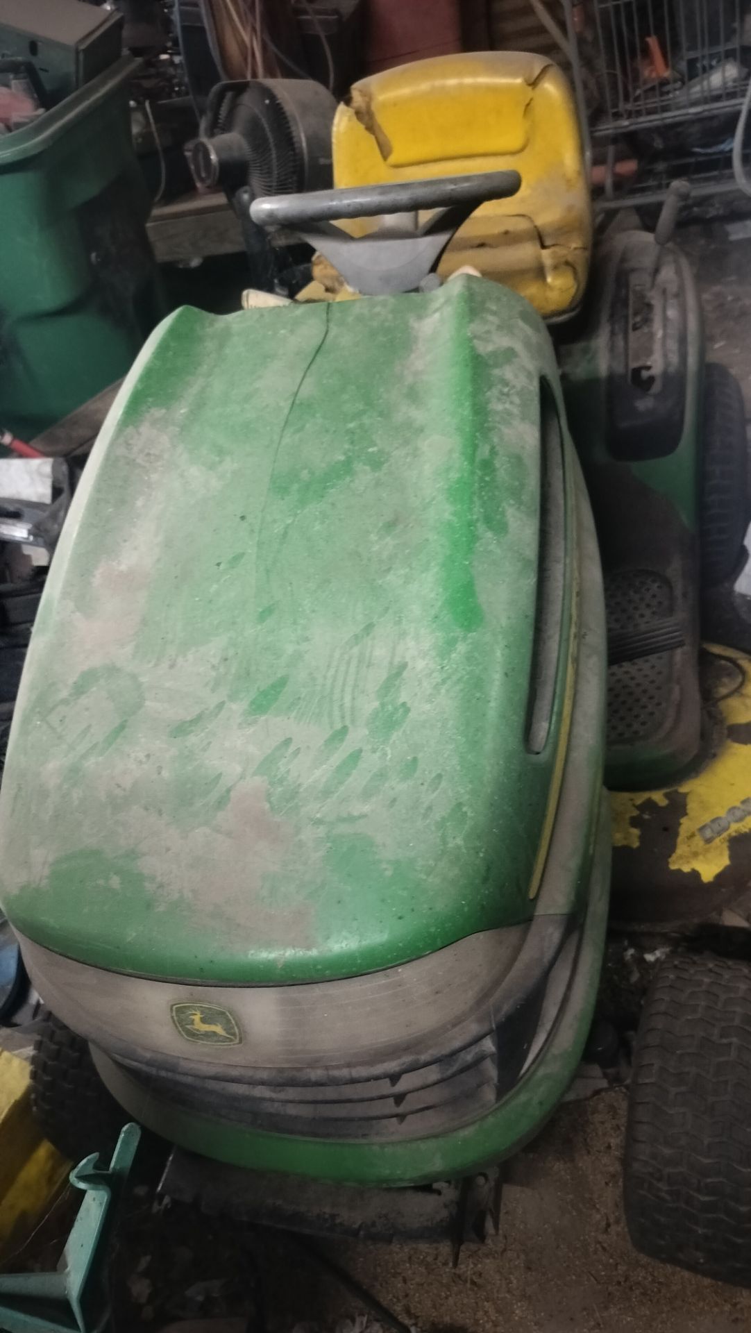 John Deere riding lawn mower for $200 as is it just needs battery and clean the carburetor