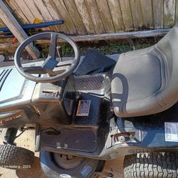 42 " MURRAY RIDER MOWER. TURNS OVER AND GOT IT STARTED WITH STARTING FLUID. NEEDS TWO REAR TIRES TLC