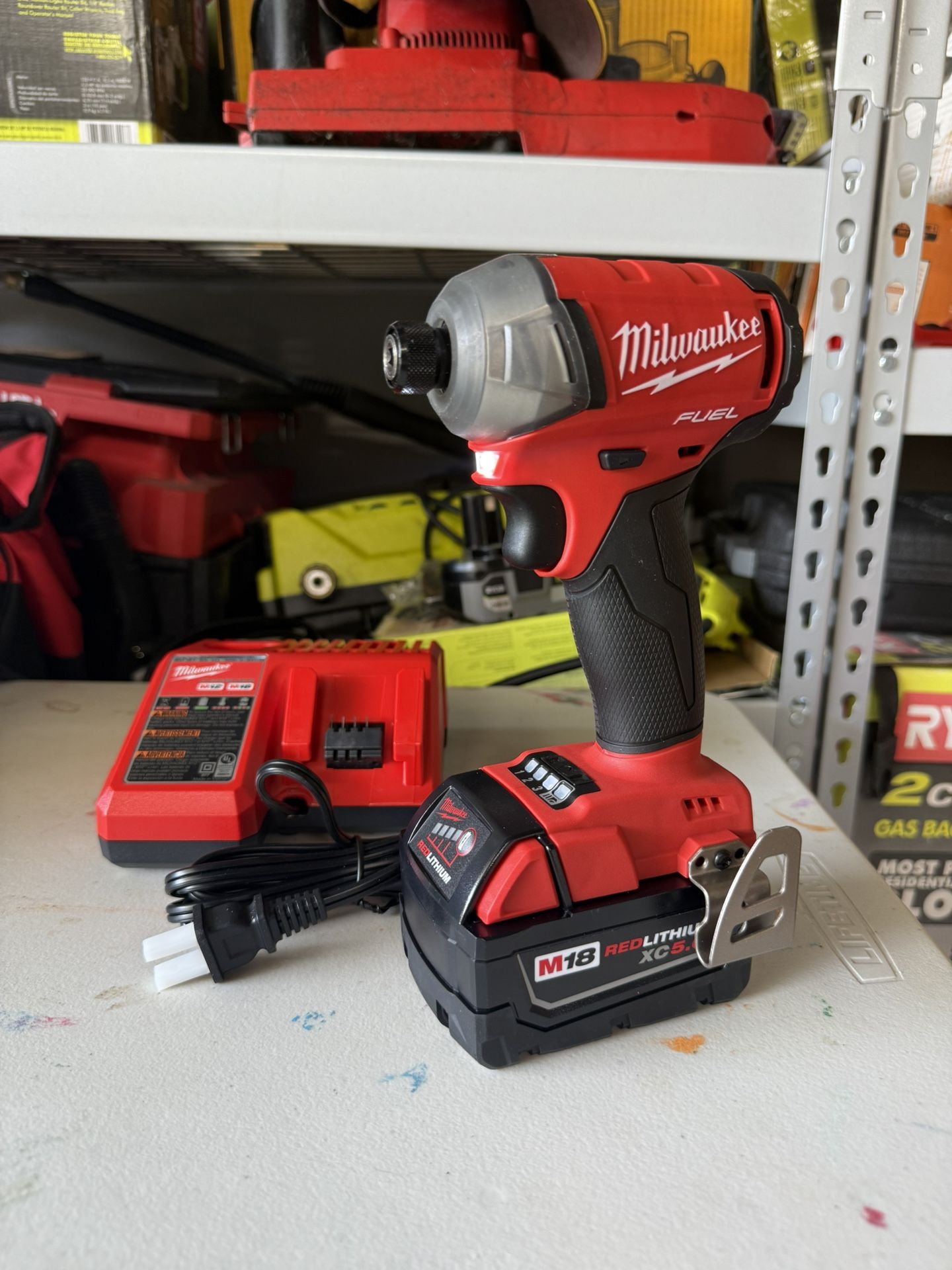 Milwaukee M18 FUEL SURGE 18V Lithium-Ion Brushless Cordless 1/4 in. Hex Impact Driver w/5.0 Battery with charger