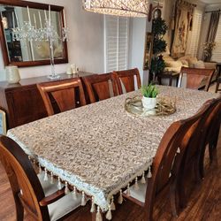 11 Piece Dining Set: Table, 8 Chairs, Buffet, and A Mirror