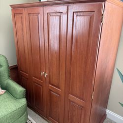 A cherry wood finish  Solid oak  Computer armor  Asking price is $600.00 Pick up in Powder Springs Ga 30127. 